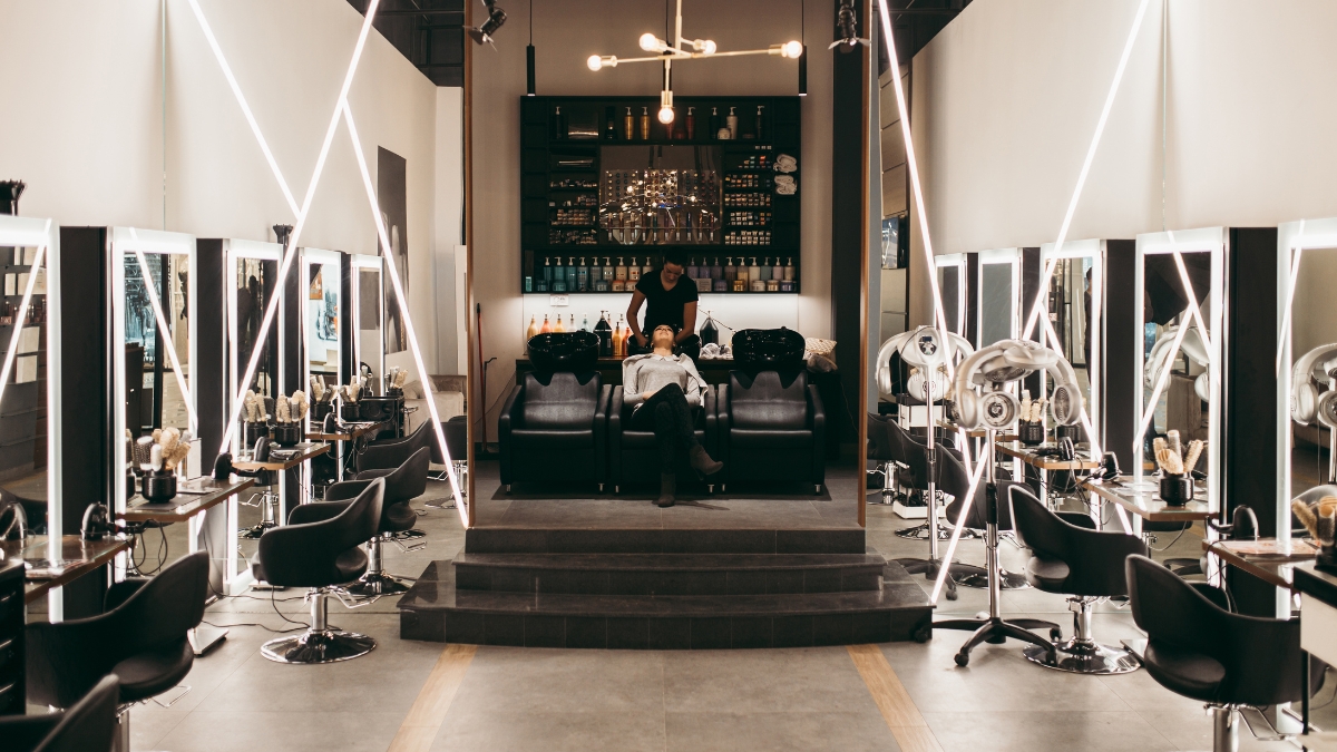 Salon owner reviewing the day inside a modern studio
